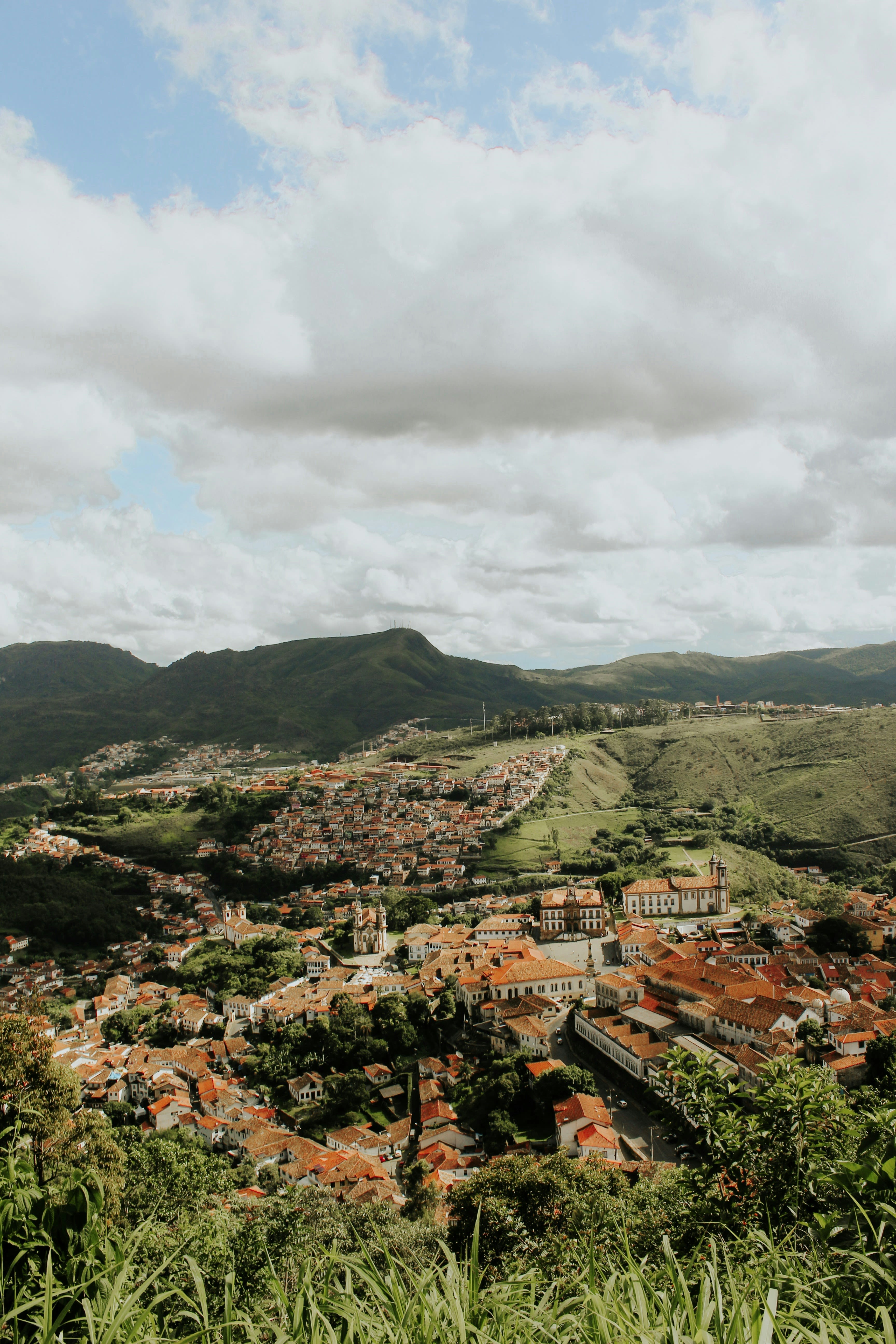 a view of a city from the top of a hill